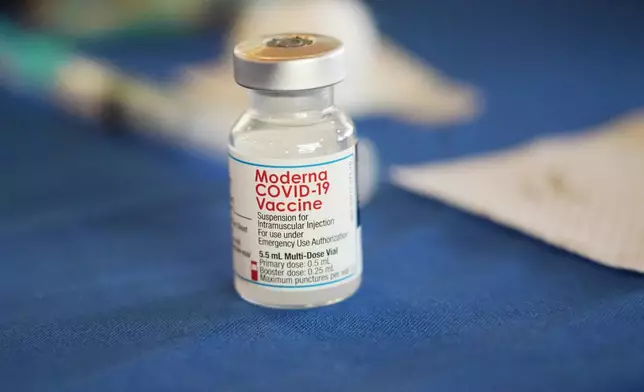 FILE - A vial of Moderna COVID-19 vaccine rests on a table at an inoculation station in Jackson, Miss., on July 19, 2022. (AP Photo/Rogelio V. Solis, File)