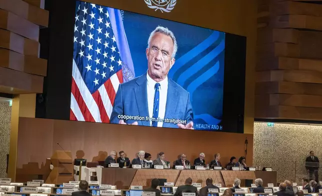 American Minister of Health, Robert Kennedy Jr, delivers a statement on a video about the historic agreement on how to combat future pandemics, aimed at avoiding a repeat of the mistakes made during the Covid-19 crisis, during the 78th World Health Assembly (WHA78) at the European headquarters of the United Nations in Geneva, Switzerland, Tuesday, May 20, 2025. (Magali Girardin/Keystone via AP)