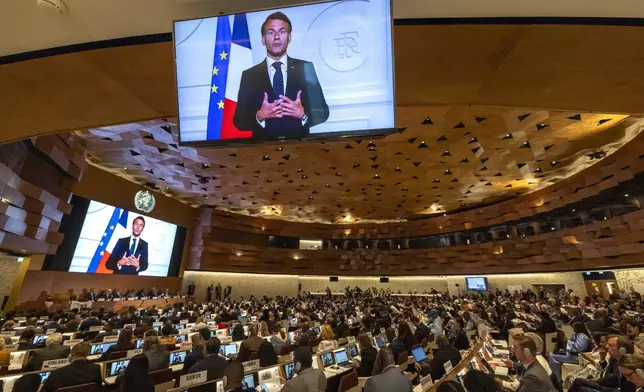 French President, Emmanuel Macron, delivers a statement on a video about the historic agreement on how to combat future pandemics, aimed at avoiding a repeat of the mistakes made during the Covid-19 crisis, during the 78th World Health Assembly (WHA78) at the European headquarters of the United Nations in Geneva, Switzerland, Tuesday, May 20, 2025. (Magali Girardin/Keystone via AP)