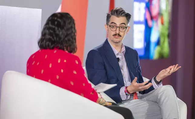 Sal Perez, executive producer and VP of Sesame Street at Sesame Workshop, right, talks to Versha Sharma, editor-in-chief at Teen Vogue, after Sesame Workshop won the Elevate Prize Foundation's Catalyst Award, Wednesday, May 14, 2025, in Miami Beach, Fla. (AP Photo/Michael Laughlin)