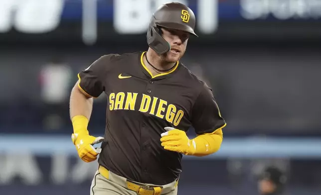 San Diego Padres' Gavin Sheets (30) rounds the bases after hitting a two-run home run off Toronto Blue Jays pitcher Bowden Francis during the second inning of a baseball game, Thursday, May 22, 2025, in Toronto (Chris Young/The Canadian Press via AP)