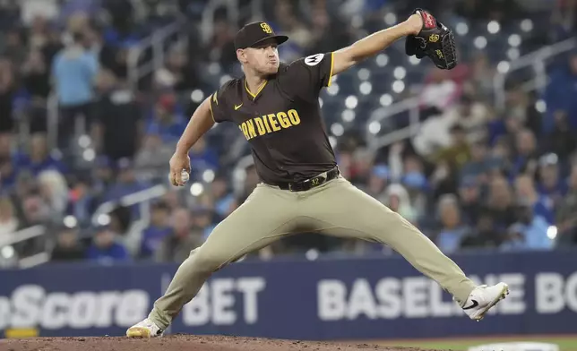San Diego Padres pitcher Stephen Kolek (32) works against the Toronto Blue Jays during the first inning of a baseball game, Thursday, May 22, 2025, in Toronto (Chris Young/The Canadian Press via AP)