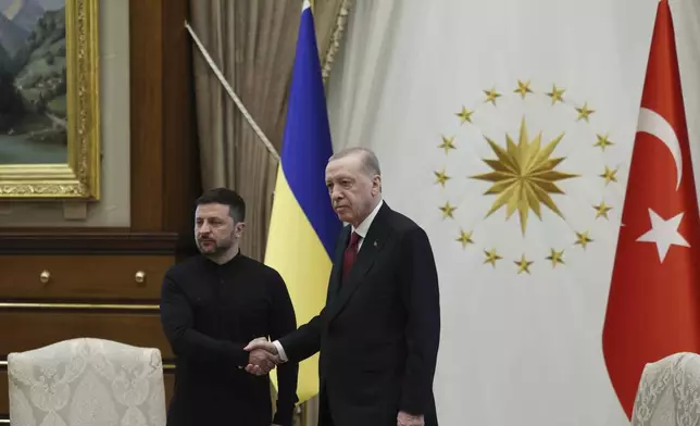 In this handout photo released by Turkish Presidency, Turkish President Recep Tayyip Erdogan, right, shakes hands with his Ukrainian counterpart Volodymyr Zelenskyy during their meeting at the Presidential palace in Ankara, Thursday, May 15, 2025. (Turkish Presidency via AP)