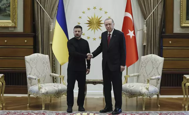 In this handout photo released by Turkish Presidency, Turkish President Recep Tayyip Erdogan, right, shakes hands with his Ukrainian counterpart Volodymyr Zelenskyy during their meeting at the Presidential palace in Ankara, Thursday, May 15, 2025. (Turkish Presidency via AP)