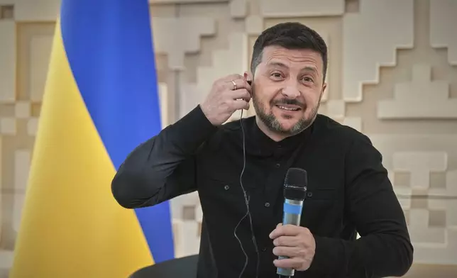 Ukrainian President Volodymyr Zelenskyy talks to journalists at the Ukrainian Embassy in Ankara, Turkey, Thursday, May 15, 2025. (AP Photo/Evgeniy Maloletka)