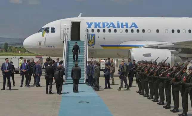 Ukrainian President Volodymyr Zelenskyy walks down the stairs from his plane upon his arrival at Esenboga airport in Ankara, Turkey, Thursday, May 15, 2025. (AP Photo/Evgeniy Maloletka)