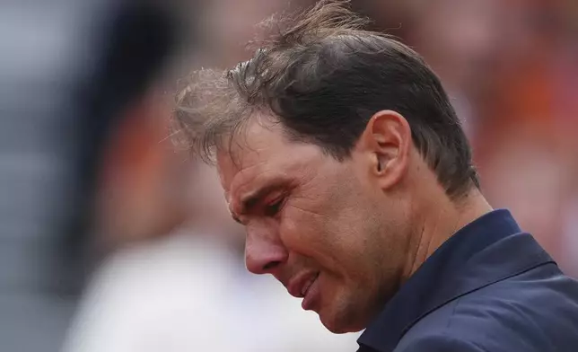 Rafa Nadal gets emotional during a farewell ceremony at center court Philippe-Chatrier, at the Roland-Garros stadium, in Paris, Sunday May 25, 2025. (AP Photo/Lindsey Wasson)