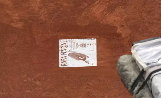 A sign for Rafa Nadal is placed during a farewell ceremony at center court Philippe-Chatrier, at the Roland-Garros stadium, in Paris, Sunday May 25, 2025. (AP Photo/Christophe Ena)