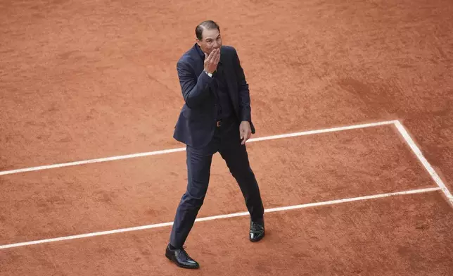 Rafa Nadal blows a kiss during a farewell ceremony at center court Philippe-Chatrier, at the Roland-Garros stadium, in Paris, Sunday May 25, 2025. (AP Photo/Christophe Ena)