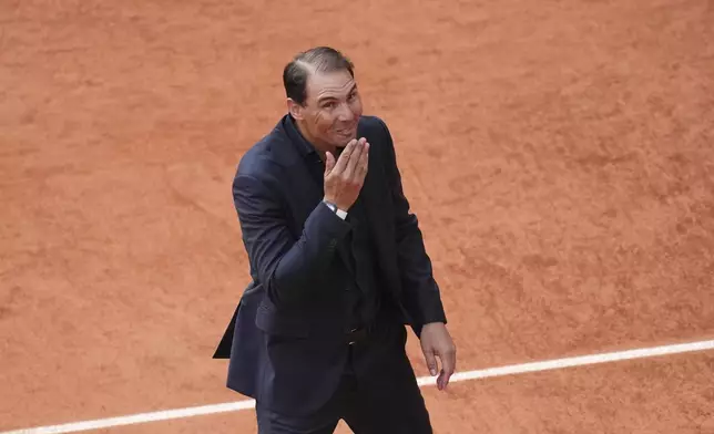 Rafa Nadal blows a kiss to fans during a farewell ceremony at center court Philippe-Chatrier, at the Roland-Garros stadium, in Paris, Sunday May 25, 2025. (AP Photo/Christophe Ena)