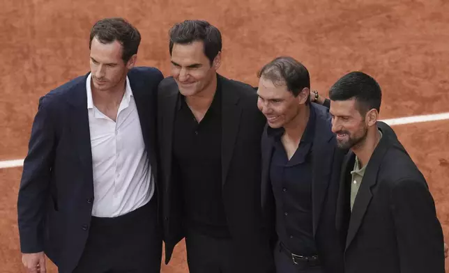 Rafa Nadal, second right, poses with, from left, Andy Murray, Roger Federer and Novak Djokovic, right, during a farewell ceremony at center court Philippe-Chatrier, at the Roland-Garros stadium, in Paris, Sunday May 25, 2025. (AP Photo/Christophe Ena)
