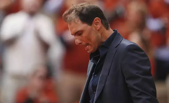 Rafa Nadal is overwhelmed with emotion during a farewell ceremony at center court Philippe-Chatrier, at the Roland-Garros stadium, in Paris, Sunday May 25, 2025 (AP Photo/Lindsey Wasson)