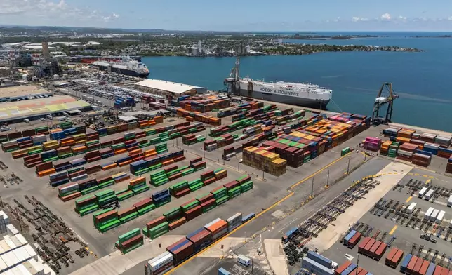 Tractor trailers and containers fill a shipping yard at the San Juan port in Puerto Rico, Thursday, May 8, 2025. (AP Photo/Alejandro Granadillo)