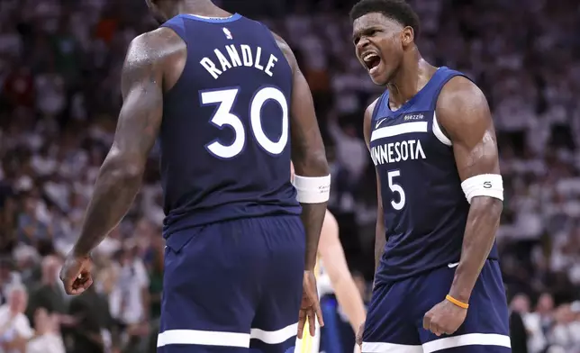 Minnesota Timberwolves' Anthony Edwards celebrates a basket and a foul for Julius Randle in 2nd quarter in NBA Western Conference Semifinals' Game 5 at Target Center in Minneapolis on Wednesday, May 14, 2025.(Scott Strazzante/San Francisco Chronicle via AP)
