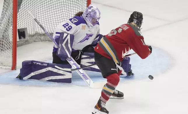 Ottawa Charge forward Katerina Mrazova (16) tries to score on Minnesota Frost goalie Nicole Hensley (29) during third period PWHL action, Wednesday, April 30, 2025 in Ottawa. (Adrian Wyld/The Canadian Press via AP)