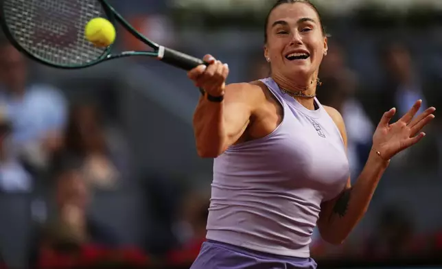 Aryna Sabalenka of Belarus returns to United States' Coco Gauff during the Madrid Open tennis final in Madrid, Spain, Saturday, May 3, 2025. (AP Photo/Jose Breton)