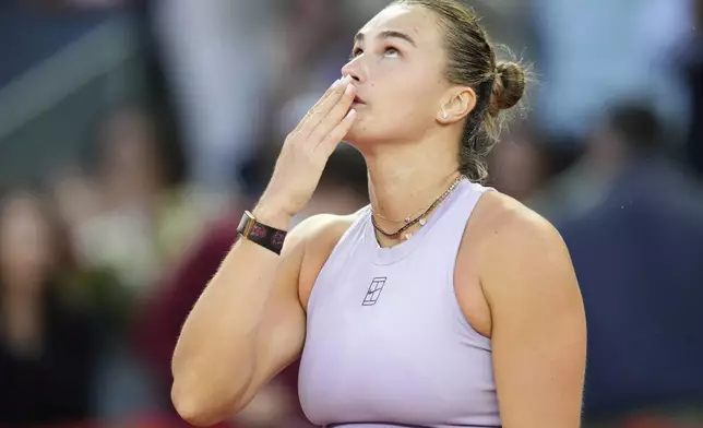 Aryna Sabalenka of Belarus reacts after winning the Madrid Open tennis final against United States' Coco Gauff in Madrid, Spain, Saturday, May 3, 2025. (AP Photo/Jose Breton)