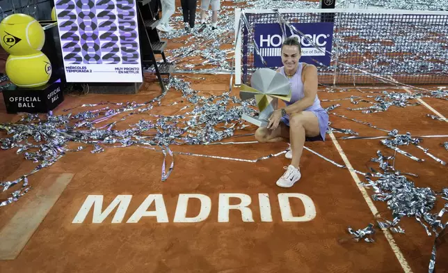 Aryna Sabalenka of Belarus holds a trophy after winning the Madrid Open tennis final in Madrid, Spain, Saturday, May 3, 2025. (AP Photo/Jose Breton)