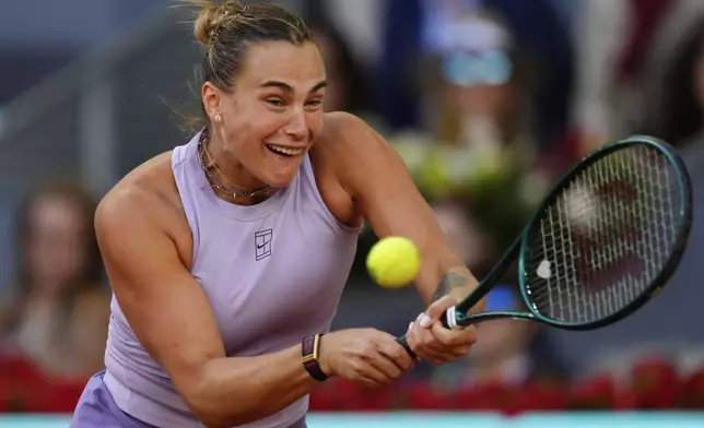Aryna Sabalenka of Belarus returns to United States' Coco Gauff during the Madrid Open tennis final in Madrid, Spain, Saturday, May 3, 2025. (AP Photo/Jose Breton)