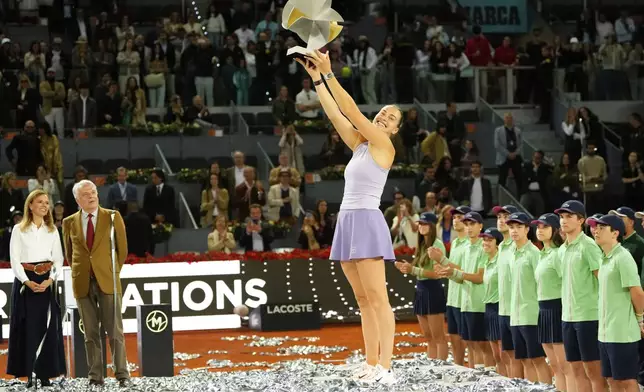 Aryna Sabalenka of Belarus holds a trophy after winning the Madrid Open tennis final in Madrid, Spain, Saturday, May 3, 2025. (AP Photo/Jose Breton)