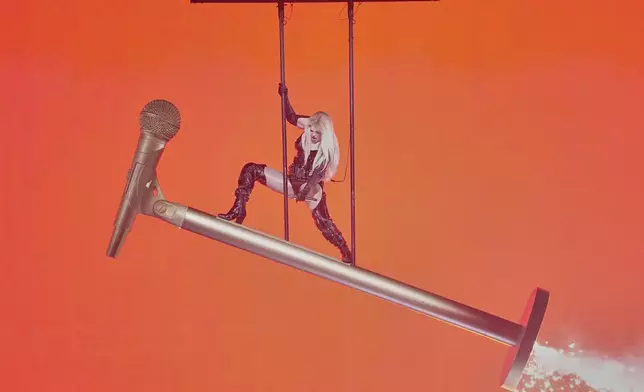 Erika Vikman from Finland performs the song "ICH KOMME" during the dress rehearsal for the Grand Final of the 69th Eurovision Song Contest, in Basel, Switzerland, Friday, May 16 2025. (AP Photo/Martin Meissner)