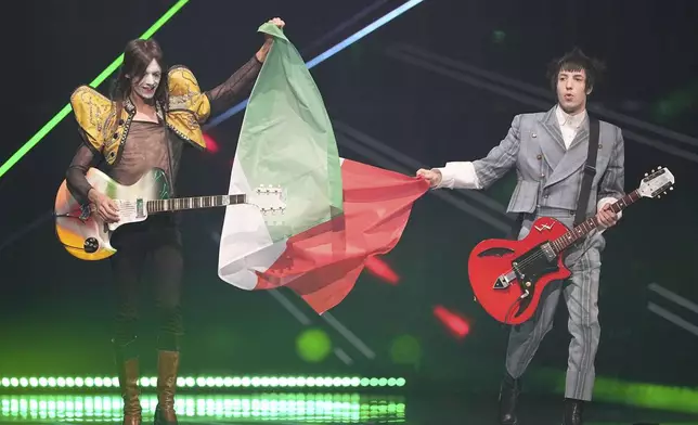 Lucio Corsi from Italy who will perform the song "Volevo Essere Un Duro" are presented to the crowd during the dress rehearsal for the Grand Final of the 69th Eurovision Song Contest, in Basel, Switzerland, Friday, May 16 2025. (AP Photo/Martin Meissner)