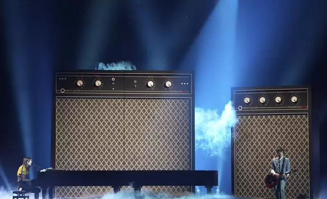 Lucio Corsi from Italy performs the song "Volevo Essere Un Duro" during the dress rehearsal for the Grand Final of the 69th Eurovision Song Contest, in Basel, Switzerland, Friday, May 16 2025. (AP Photo/Martin Meissner)