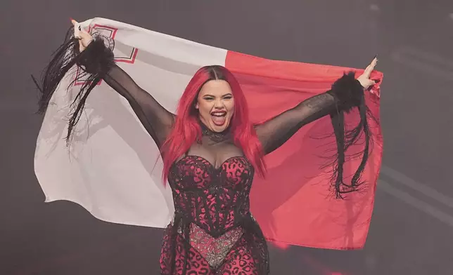 Miriana Conte from Malta who will perform the song "SERVING" is introduced to the crowd during the dress rehearsal for the Grand Final of the 69th Eurovision Song Contest, in Basel, Switzerland, Friday, May 16 2025. (AP Photo/Martin Meissner)
