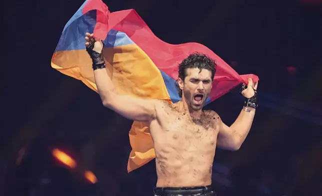 PARG from Armenia who will perform the song "SURVIVOR" is introduced to the crowd during the dress rehearsal for the Grand Final of the 69th Eurovision Song Contest, in Basel, Switzerland, Friday, May 16 2025. (AP Photo/Martin Meissner)