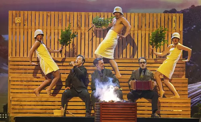 KAJ from Sweden performs the song "Bara Bada Bastu" during the dress rehearsal for the Grand Final of the 69th Eurovision Song Contest, in Basel, Switzerland, Friday, May 16 2025. (AP Photo/Martin Meissner)