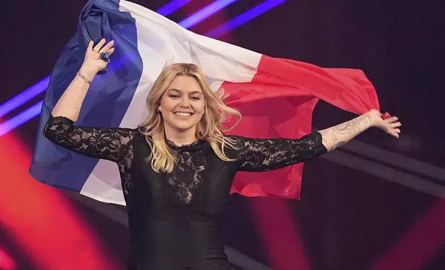 Louane from France who will perform the song "maman" onstage during the dress rehearsal for the Grand Final of the 69th Eurovision Song Contest, in Basel, Switzerland, Friday, May 16 2025. (AP Photo/Martin Meissner)