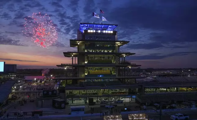 Fireworks are set off behind the Pagoda as the public gates open ahead of the Indianapolis 500 IndyCar auto race at the Indianapolis Motor Speedway in Indianapolis, Sunday, May 25, 2025. (AP Photo/Michael Conroy)