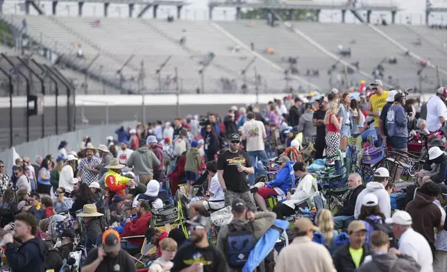 Fans congregate before the start of the Indianapolis 500 auto race at Indianapolis Motor Speedway in Indianapolis, Sunday, May 25, 2025. (AP Photo/AJ Mast)