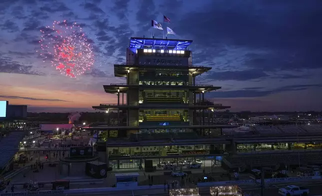 Fireworks are set off behind the Pagoda as the public gates open ahead of the Indianapolis 500 IndyCar auto race at the Indianapolis Motor Speedway in Indianapolis, Sunday, May 25, 2025. (AP Photo/Michael Conroy)