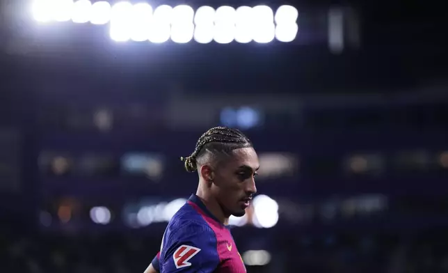 Barcelona's Raphinha runs during the Spanish La Liga soccer match between Valladolid and FC Barcelona at the Jose Zorrilla stadium in Valladolid, Spain, Saturday, May 3, 2025. (AP Photo/Manu Fernandez)