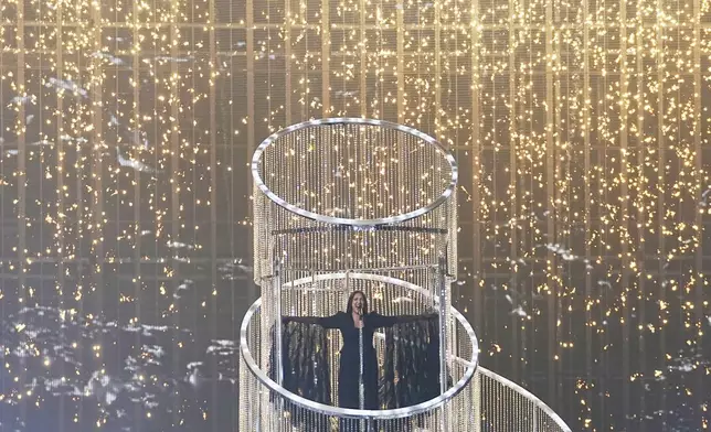 Yuval Raphael from Israel performs the song "New Day Will Rise" during the dress rehearsal for the Grand Final of the 69th Eurovision Song Contest, in Basel, Switzerland, Friday, May 16 2025. (AP Photo/Martin Meissner)