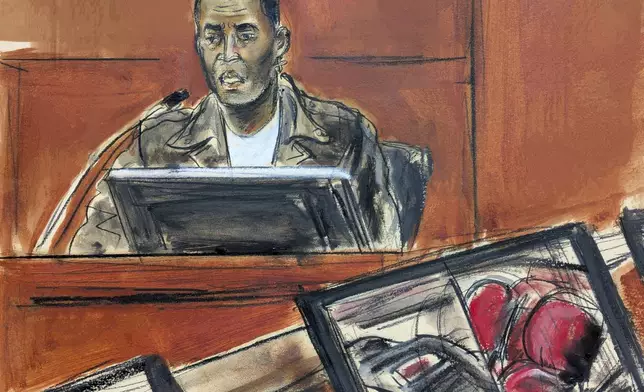 Music artist Kid Cudi testifies on the witness stand during Sean "Diddy" Combs' sex trafficking and racketeering trial in Manhattan federal court,Thursday, May 22, 2025, in New York. (Elizabeth Williams via AP)