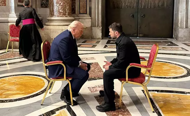FILE - In this photo provided by the Ukrainian Presidential Press Office, President Volodymyr Zelenskyy, right, and President Donald Trump, talk as they attend the funeral of Pope Francis in St. Peter’s Basilica in Vatican City, April 26, 2025.(Ukrainian Presidential Press Office via AP, File)