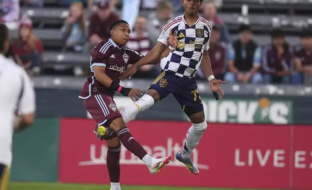 Real Salt Lake forward Zavier Gozo, right, heads the ball as Colorado Rapids defender Jackson Travis, left, defends in the first half of an MLS soccer match Saturday, May 17, 2025, in Commerce City, Colo. (AP Photo/David Zalubowski)