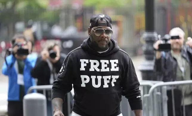 A man arrives to the federal courthouse wearing a shirt supporting Sean "Diddy" Combs in New York, Monday, May 5, 2025. (AP Photo/Seth Wenig)