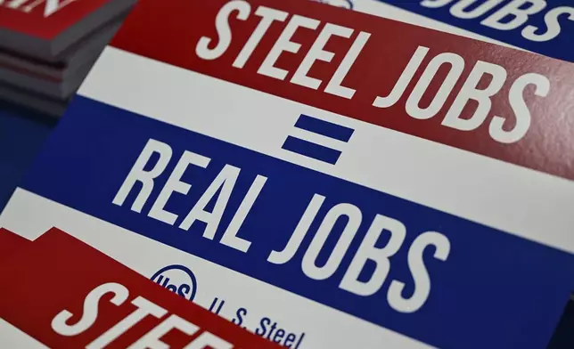 Signs are photographed before President Donald Trump speaks at United States Steel Corporation's Mon Valley Works-Irvin Plant, Friday, May 30, 2025, in West Mifflin, Pa. (AP Photo/David Dermer)