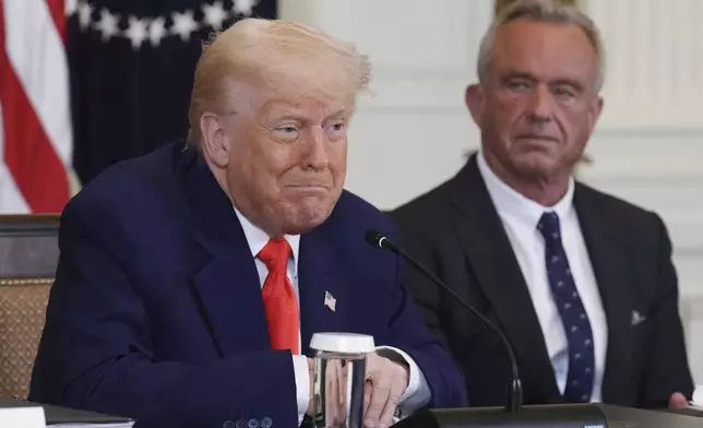 President Donald Trump, left, speaks as Health and Human Services Secretary Robert F. Kennedy Jr. listens during a Make America Healthy Again (MAHA) Commission Event in the East Room of the White House, Thursday, May 22, 2025, in Washington. (AP Photo/Jacquelyn Martin)