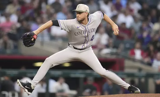 Colorado Rockies starting pitcher Carson Palmquist throws against the Arizona Diamondbacks during the second inning of a baseball game Friday, May 16, 2025, in Phoenix. (AP Photo/Ross D. Franklin)