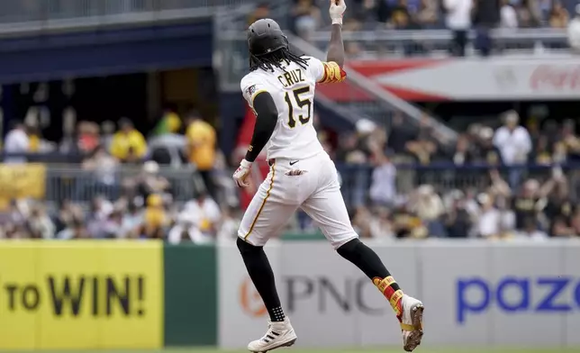Pittsburgh Pirates' Oneil Cruz rounds the bases after hitting a home run during the third inning of a baseball game against the Milwaukee Brewers, Sunday, May 25, 2025, in Pittsburgh. (AP Photo/Matt Freed)
