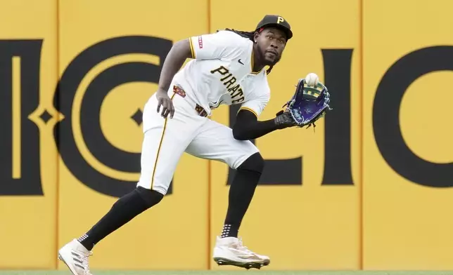 Pittsburgh Pirates center fielder Oneil Cruz catches a line drive hit by Milwaukee Brewers' Jackson Chourio during the fifth inning of a baseball game Sunday, May 25, 2025, in Pittsburgh. (AP Photo/Matt Freed)