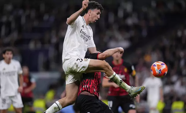 Real Madrid's Jacobo Ramon scores his side's second goal during a Spanish La Liga soccer match between Real Madrid and Mallorca in Madrid, Spain, Wednesday, May 14, 2025. (AP Photo/Manu Fernandez)