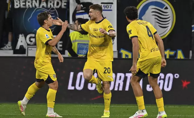 Parma's Antoine Hainaut celebrates after scoring a goal for his team during the Serie A soccer match between Atalanta and Parma at the Gewiss Stadium in Bergamo, Italy, Sunday, May 25, 2025. (Tano Pecoraro/LaPresse via AP)