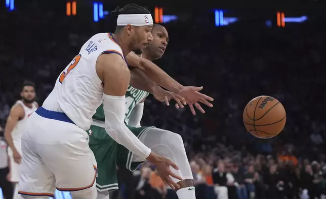 New York Knicks' Josh Hart (3) and Boston Celtics' Al Horford (42) fights for control of the ball during the first half of Game 6 in the Eastern Conference semifinals of the NBA basketball playoffs Friday, May 16, 2025, in New York. (AP Photo/Frank Franklin II)