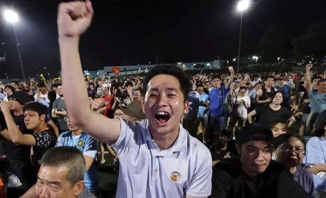 Workers' Party (WP) supporters react at an assembly centre during the general election, in Singapore, Saturday, May 3, 2025. (AP Photo/Suhaimi Abdullah)