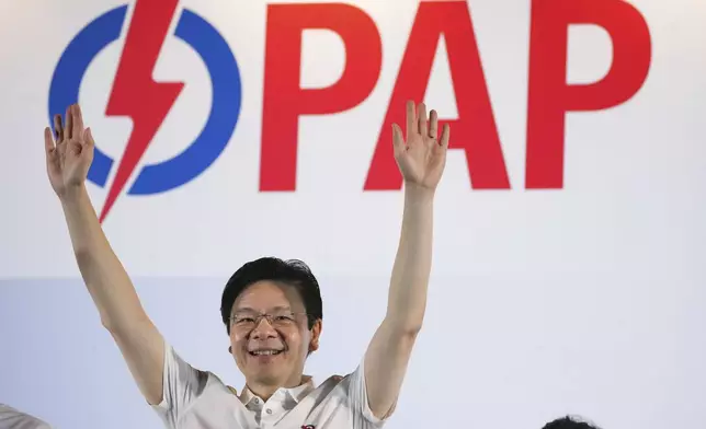 Prime Minister Lawrence Wong's, from People's Action Party (PAP) thanks his supporters and voters at an assembly area for People's Action Party supporters, on the day of the general election in Singapore, Saturday, May 3, 2025. (AP Photo/Vincent Thian)